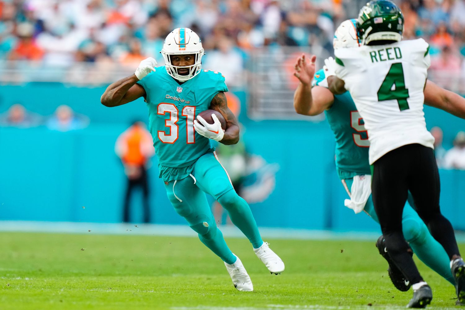 Miami Dolphins' RB Raheem Mostert carries the ball