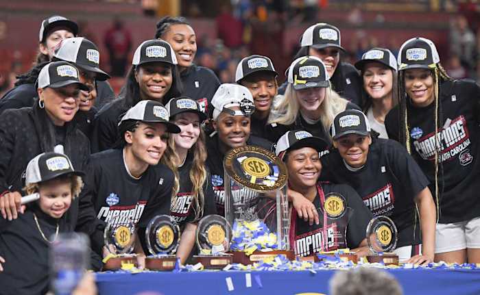 Mar 5, 2023; Greenville, SC, USA; South Carolina Gamecocks players gather around the SEC Championship trophy after the SEC Women's Basketball Tournament at Bon Secours Wellness Arena.