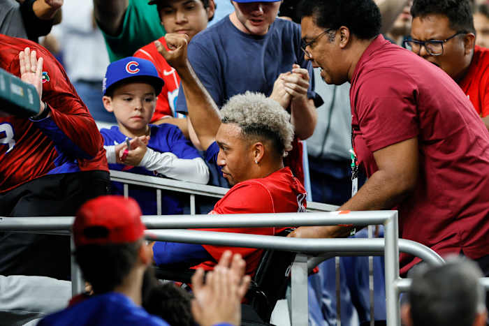 Edwin Diaz is carted off in a wheelchair after suffering an apparent knee injury playing for Puerto Rico in the WBC