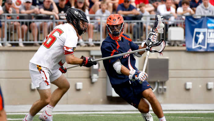 Connor Shellenberger dodges against Ajax Zappitello during the Virginia men's lacrosse game against Maryland in the quarterfinals of the NCAA Men's Lacrosse Tournament at Ohio Stadium.