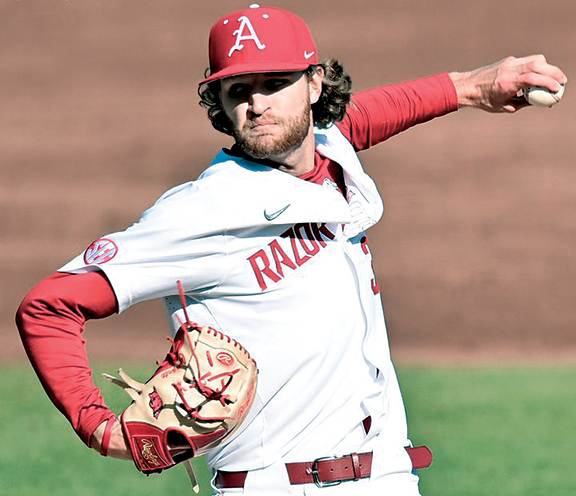 Hunter Hollan pitches in the SEC opener against Auburn at Baum-Walker Stadium.