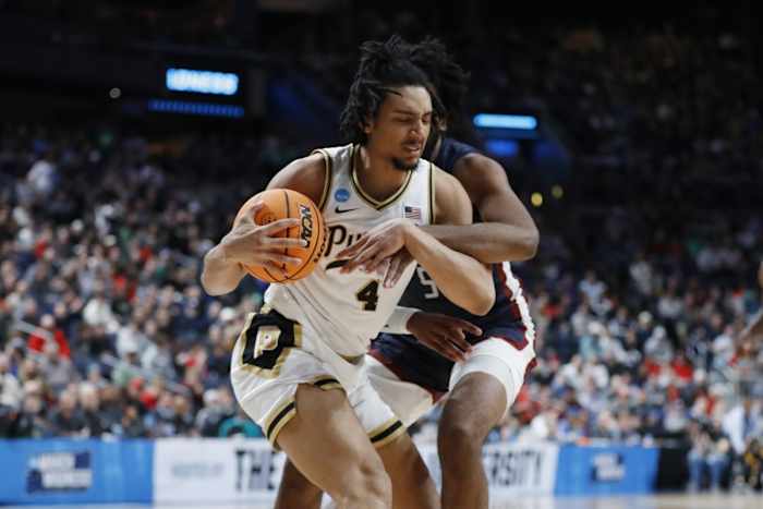 Trey Kaufman-Renn (4) battles Fairleigh Dickinson Knights forward Ansley Almonor (5) for the ball.