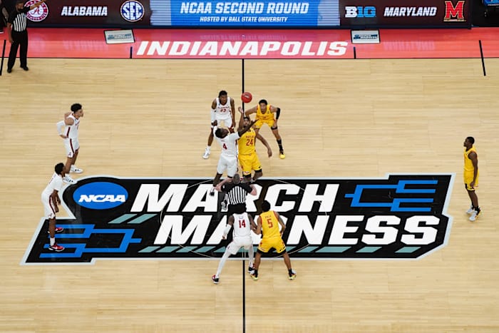 Alabama Crimson Tide forward Juwan Gary (4) and Maryland Terrapins forward Donta Scott (24) jump for the tipoff in the second round of the 2021 NCAA Tournament at Bankers Life Fieldhouse.
