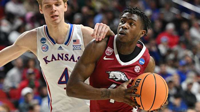 Razorbacks Davonte Davis drives against Kansas in NCAA Tournament on Saturday.