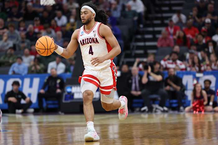 Arizona Wildcats guard Kylan Boswell dribbles the ball down the court.