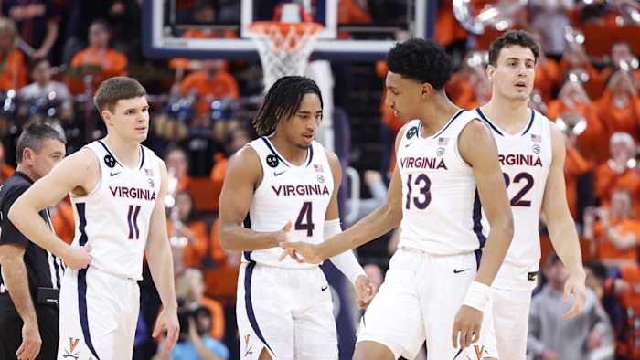 Isaac McKneely, Armaan Franklin, Ryan Dunn, and Francisco Caffaro walk off the floor during the Virginia men's basketball game against Clemson at John Paul Jones Arena.