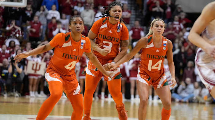 Miami’s Jasmyne Roberts, Destiny Harden and Haley Cavinder  react after Harden hit a late shot to help the Hurricanes beat Indiana in the second round of the NCAA women’s tournament.