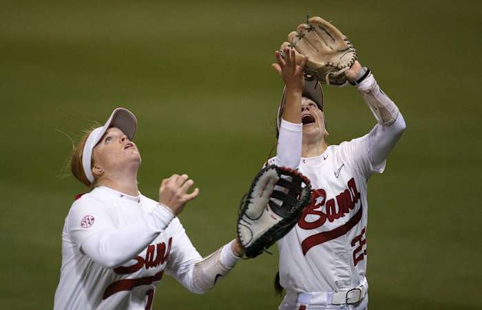 Mar 20, 2023; Tuscaloosa, AL, USA; Alabama utility player Emma Broadfoot (12) and Alabama infielder Kali Heivilin (22) drift back for a fly ball in shallow right field during Alabama s 2-1 loss in extra innings to Arkansas. The Tide dropped two out of three games to the Razorbacks.