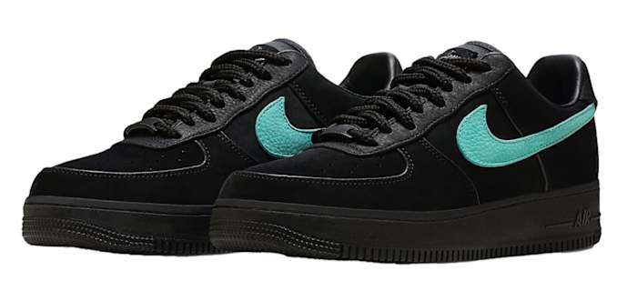 View of black and blue Nike Air Force 1 shoes.