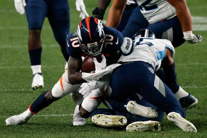 Denver wide receiver Jerry Jeudy (10) is tackled by Tennessee linebacker Harold Landry III (58) and cornerback Kristian Fulton (26). (Isaiah J. Downing-USA TODAY Sports)
