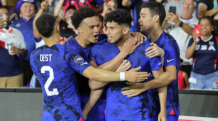 The USMNT celebrating a goal