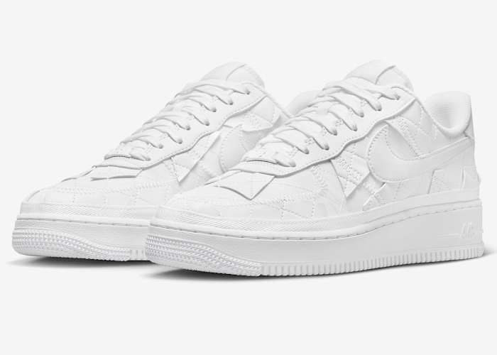 View of white Nike Air Force 1 shoes.