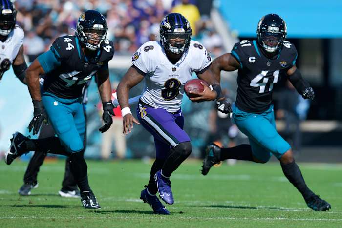 Jacksonville Jaguars linebacker Travon Walker (44) and linebacker Josh Allen (41) try to run down Baltimore Ravens quarterback Lamar Jackson (8) during early fourth quarter action. Offsetting penalties negated the play. The Jacksonville Jaguars hosted the Baltimore Ravens at TIAA Bank Field in Jacksonville, FL Sunday, November 27, 2022. [Bob Self/Florida Times-Union] Jki 112722 Bs Jaguars Vs Ravens 44