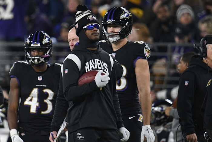 Jan 1, 2023; Baltimore, Maryland, USA; Baltimore Ravens quarterback Lamar Jackson (8) holds a ball on the sidelines during the game Pittsburgh Steelers at M&T Bank Stadium. Mandatory Credit: Tommy Gilligan-USA TODAY Sports
