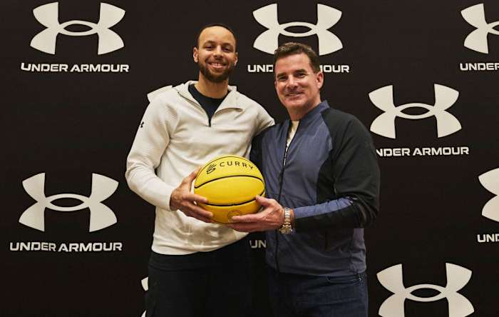 Stephen Curry poses for a photo with Kevin Plank.