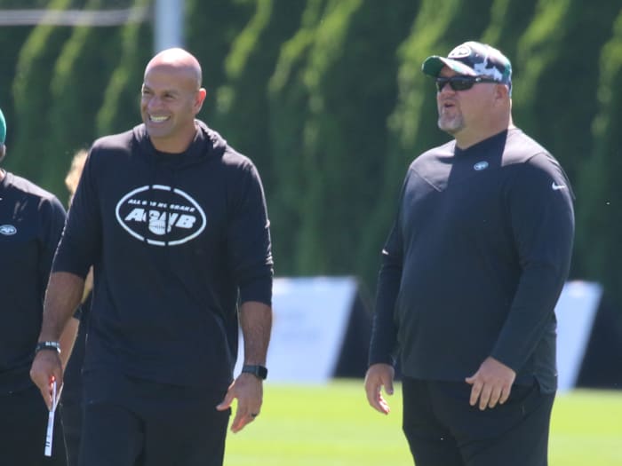 Robert Saleh and Joe Douglas on the practice field