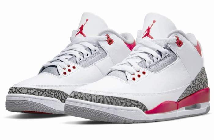 View of white and red Air Jordan sneakers.