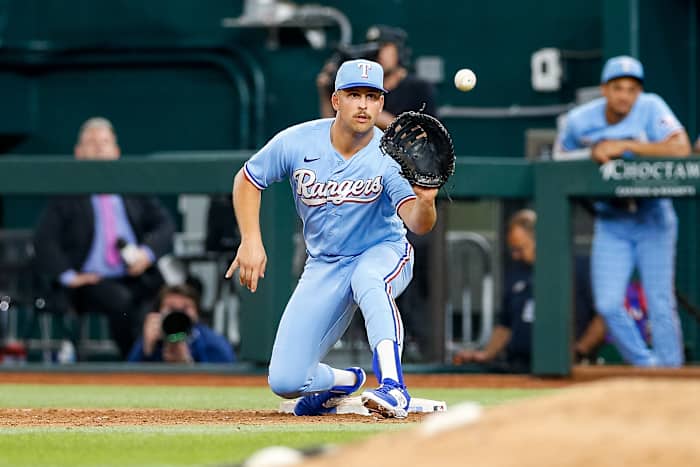 Apr 2, 2023; Arlington, Texas, USA; Texas Rangers first baseman Nathaniel Lowe (30) fields a throw during the eighth inning against the Philadelphia Phillies at Globe Life Field. Mandatory Credit: Andrew Dieb-USA TODAY Sports