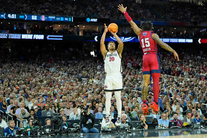San Diego State Aztecs guard Matt Bradley shoots a jump shot with a FAU defender reaching up to try and guard it