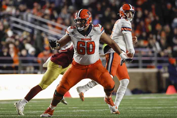 Nov 26, 2022; Chestnut Hill, Massachusetts, USA; Syracuse Orange offensive lineman Matthew Bergeron (60) blocks against the Boston College Eagles during the second quarter at Alumni Stadium. Mandatory Credit: Winslow Townson-USA TODAY Sports