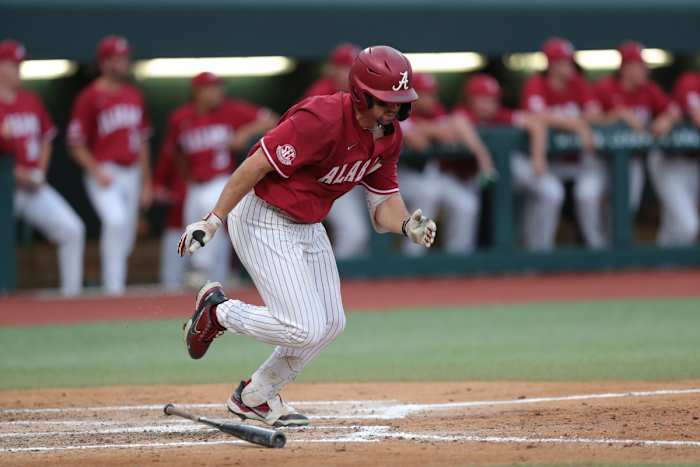 Alabama outfielder Tommy Seidl (20) runs to first in the Crimson Tide's 10-2 win over the Troy Trojans on April 4, 2023 at Sewell-Thomas Stadium in Tuscaloosa, Ala.