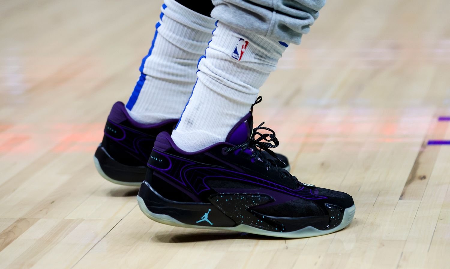 View of Luka Doncic's black and purple Jordan sneakers.