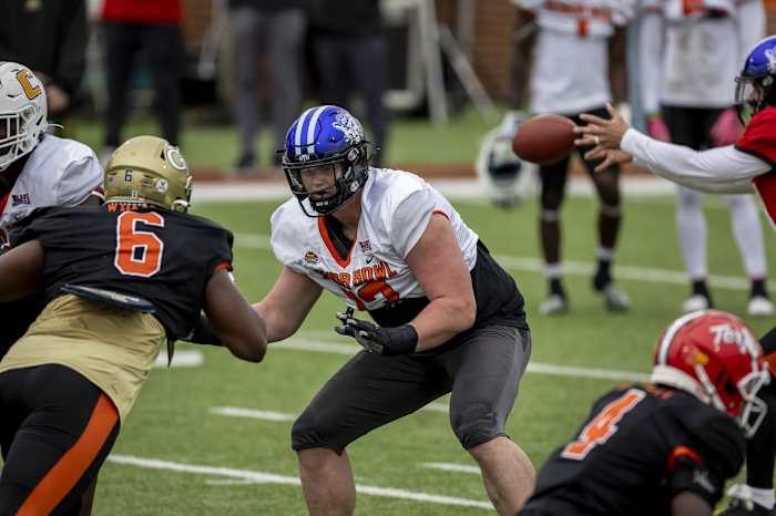 Feb 1, 2023; Mobile, AL, USA; National offensive lineman Blake Freeland of Brigham Young (73) practices with National defensive lineman Keion White of Georgia Tech (6) during the second day of Senior Bowl week at Hancock Whitney Stadium in Mobile. Mandatory Credit: Vasha Hunt-USA TODAY Sports