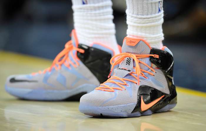 View of LeBron James' blue and orange Nike shoes.