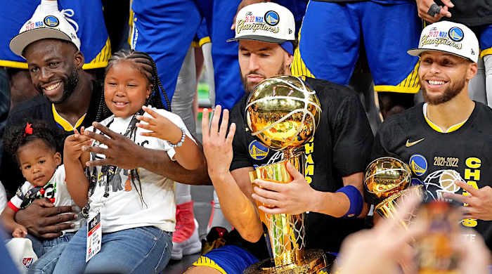 Draymond Green, Klay Thompson, Stephen Curry celebrate Warriors 2022 NBA title.