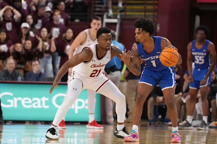 Jan 28, 2023; Charleston, South Carolina, USA; Hofstra Pride guard Aaron Estrada (1) tries to get past Charleston Cougars guard Jaylon Scott (21) in the second half at TD Arena. Mandatory Credit: David Yeazell-USA TODAY Sports