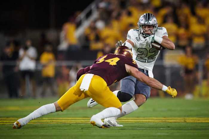 Sep 17, 2022; Tempe, Arizona, USA; Eastern Michigan Eagles running back Samson Evans (22) attempts to block a tackle by Arizona State Sun Devils linebacker Kyle Soelle (34) at Sun Devil Stadium in Tempe. Football Asu Fb