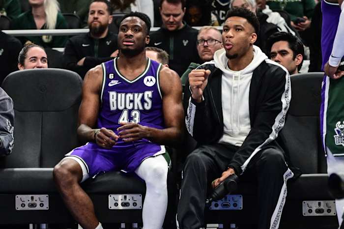 Apr 7, 2023; Milwaukee, Wisconsin, USA; Milwaukee Bucks forward Giannis Antetokounmpo sits with his brother forward Thanasis Antetokounmpo