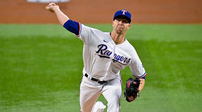 Rangers starting pitcher Jacob deGrom throws a pitch.