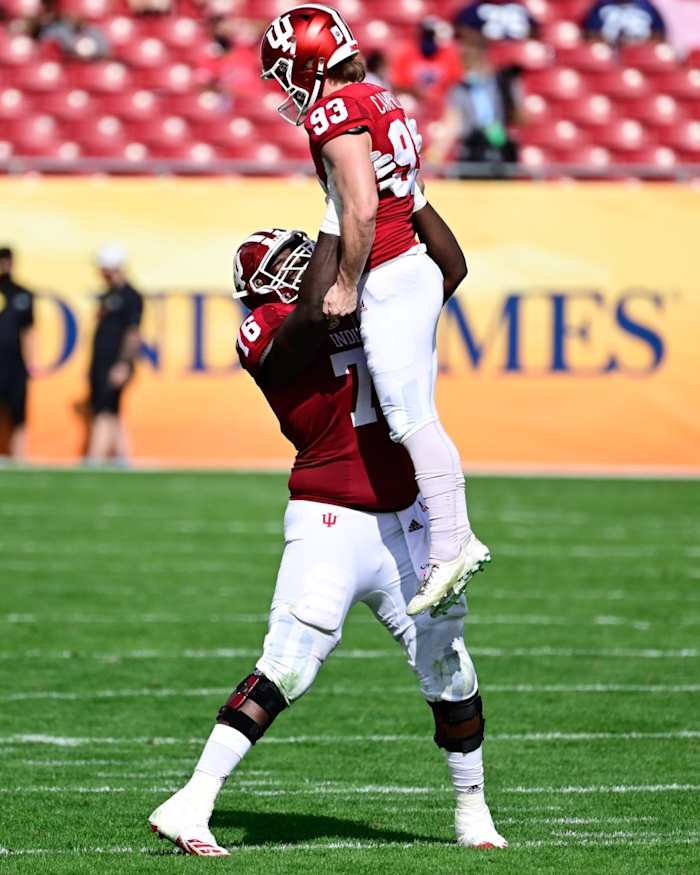 Indiana Hoosiers place kicker Charles Campbell (93) and offensive lineman Matthew Bedford (76) react after kicking a 50-yard field goal during the first half against the Mississippi Rebels during the Outback Bowl at Raymond James Stadium.