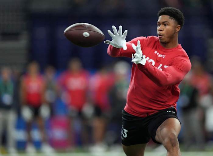 Mar 4, 2023; Indianapolis, IN, USA; Cincinnati wide receiver Tyler Scott (WO43) participates in drills at Lucas Oil Stadium.