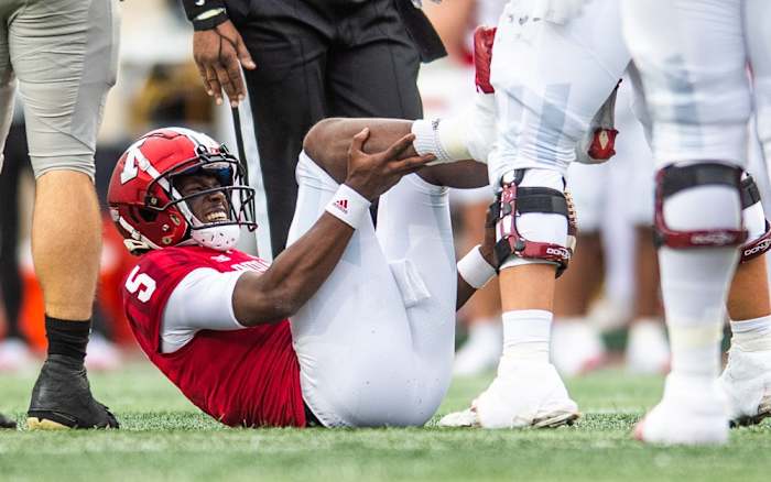 Indiana's Dexter Williams (5) winces in pain as he is injured during the first half of the Indiana versus Purdue football game at Memorial Stadium on Saturday, Nov. 26, 2022.