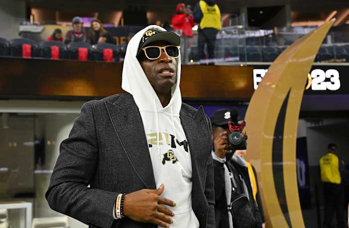 Deion Sanders watches the CFP National Championship Game.