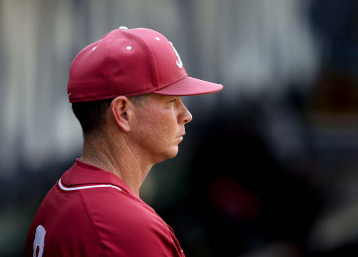 Alabama Head Coach Brad Bohannon watches from the dugout as the Crimson Tide defeats South Carolina during the SEC Tournament Tuesday, May 25, 2021, in the Hoover Met in Hoover, Alabama.