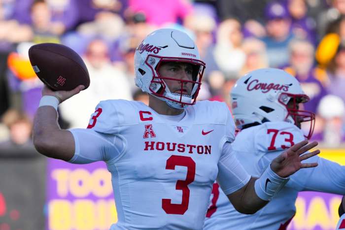 Houston Cougars quarterback Clayton Tune (3) throws the ball against the East Carolina Pirates during the first half at Dowdy-Ficklen Stadium.