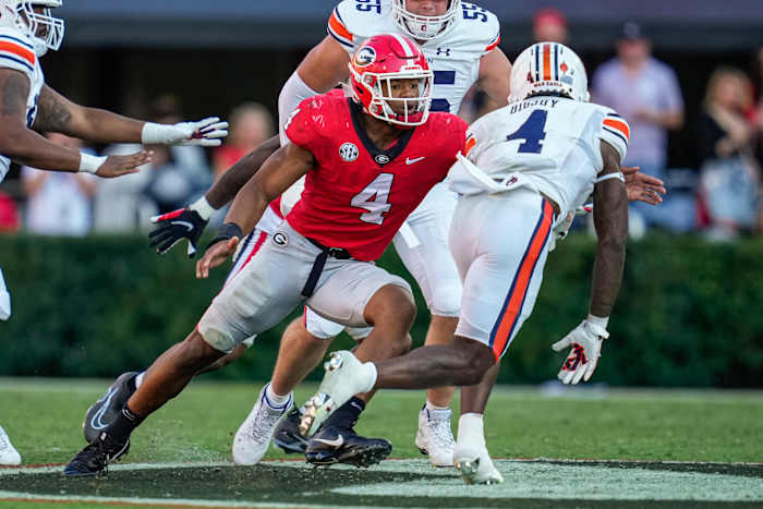 Oct 8, 2022; Athens, Georgia, USA; Georgia Bulldogs linebacker Nolan Smith (4) tackles Auburn Tigers running back Tank Bigsby (4) at Sanford Stadium.