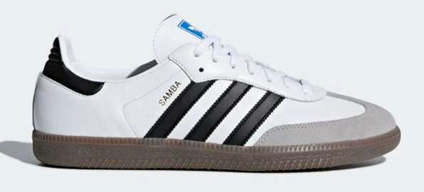 Side view of a white and black adidas shoe.