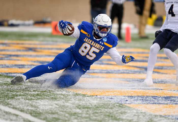 South Dakota State s Tucker Kraft uses the existing layer of snow to slide into the end zone for the first touchdown of the FCS semifinal game against Montana State on Saturday, December 17, 2022, at Dana J. Dykhouse Stadium in Brookings, SD. Fcs Semifinals 001