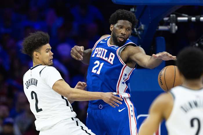 Joel Embiid blocking a shot against the Nets