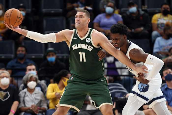 Milwaukee Bucks center Brook Lopez (11) fights for position against Memphis Grizzles forward Jaren Jackson Jr. (13)