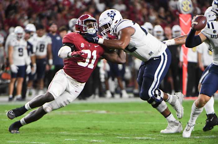 Utah State Aggies offensive lineman Alfred Edwards (72) blocks against Alabama Crimson Tide linebacker Will Anderson Jr. (31) at Bryant-Denny Stadium.