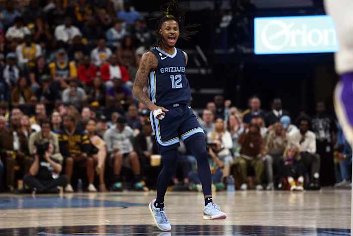 Memphis Grizzlies guard Ja Morant reacts after a play.