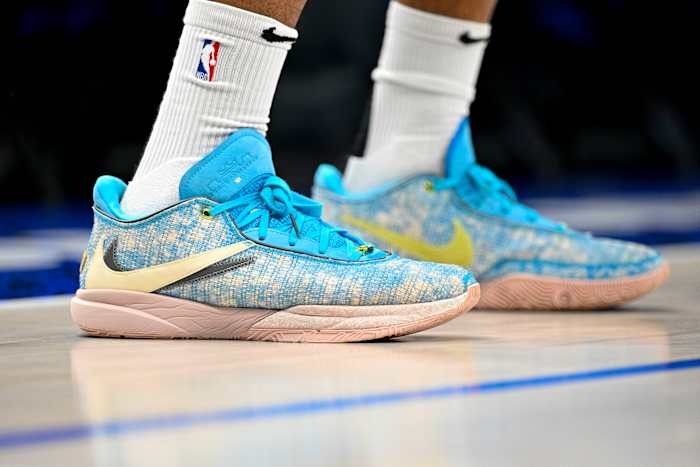 View of blue and grey Nike LeBron shoes.