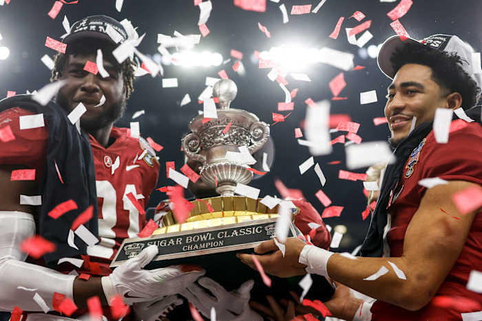 Young (with Will Anderson Jr., far left), ended his college career by throwing five TDs in the Sugar Bowl.