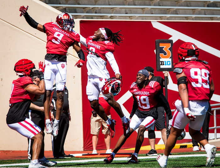Indiana's Noah Pierre (0) and the defense congratulate Jamier Johnson (9) for his interception of Tayven Jackson (2) during Indiana football's Spring Football Saturday event at Memorial Stadium on Saturday, April 15, 2023.