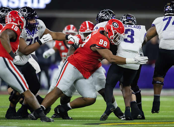 Jan 9, 2023; Inglewood, CA, USA; Georgia Bulldogs defensive lineman Jalen Carter (88) tackles TCU Horned Frogs running back Emari Demercado (3) during the CFP national championship game at SoFi Stadium. Mandatory Credit: Mark J. Rebilas-USA TODAY Sports